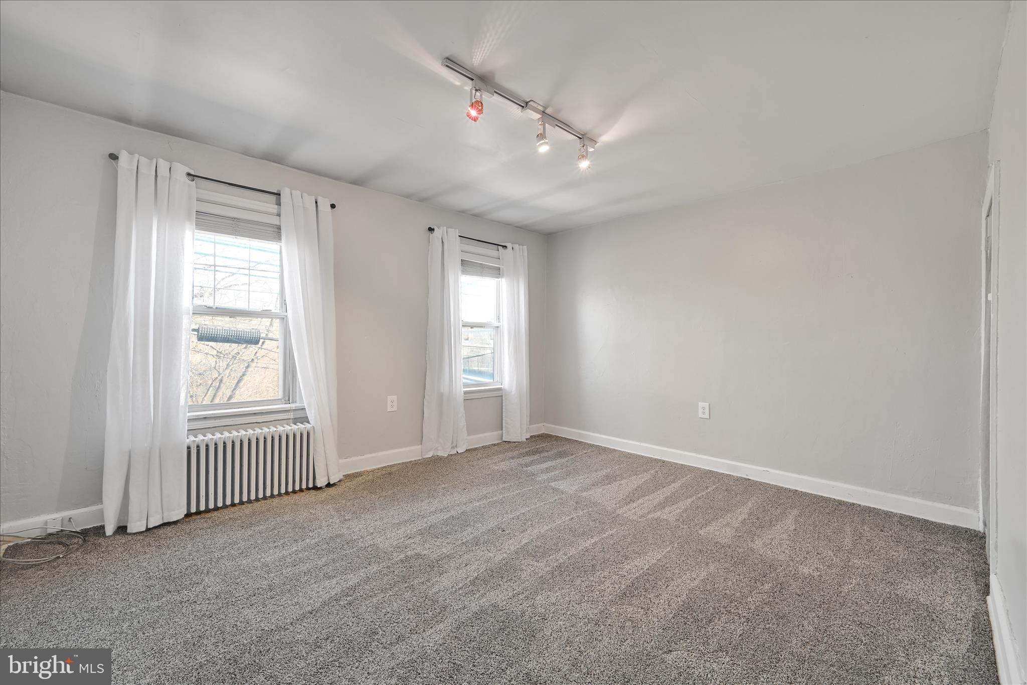 205 Front Street Conshohocken, PA 19428 - Photo 18 of 31 an empty room with windows and closet area