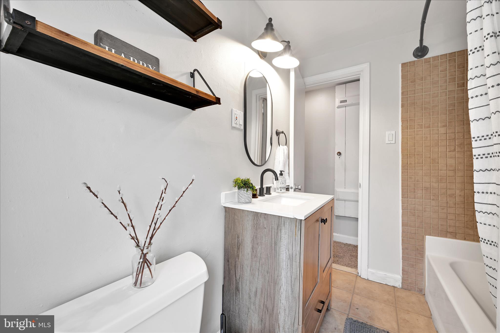 205 Front Street Conshohocken, PA 19428 - Photo 22 of 31 a bathroom with a sink a mirror and a shower