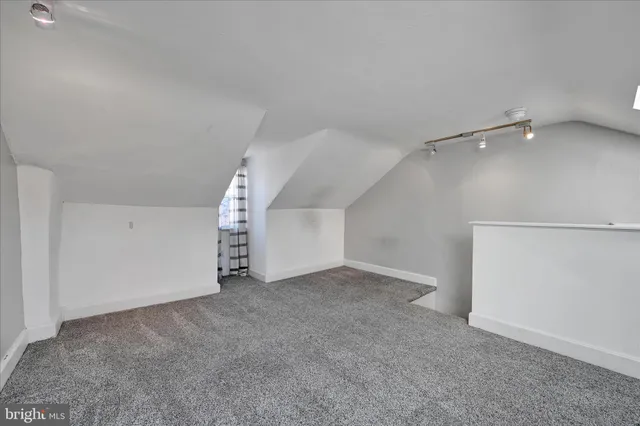 a view of a wooden deck with a yard