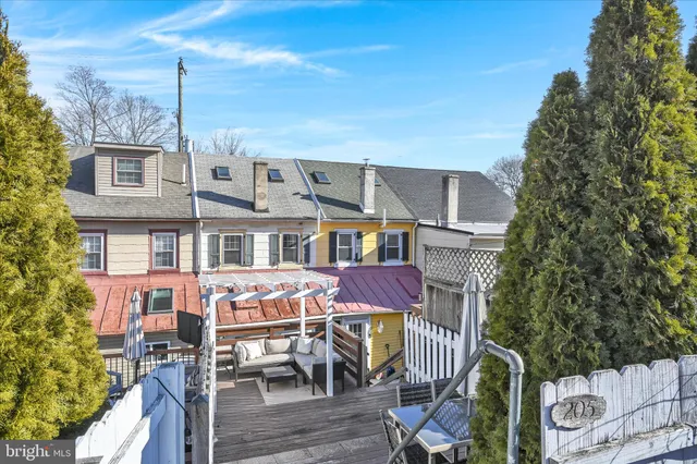 a view of a patio with table and chairs