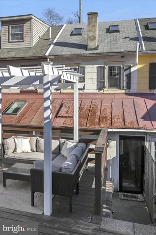 a view of a chairs and table on the wooden deck