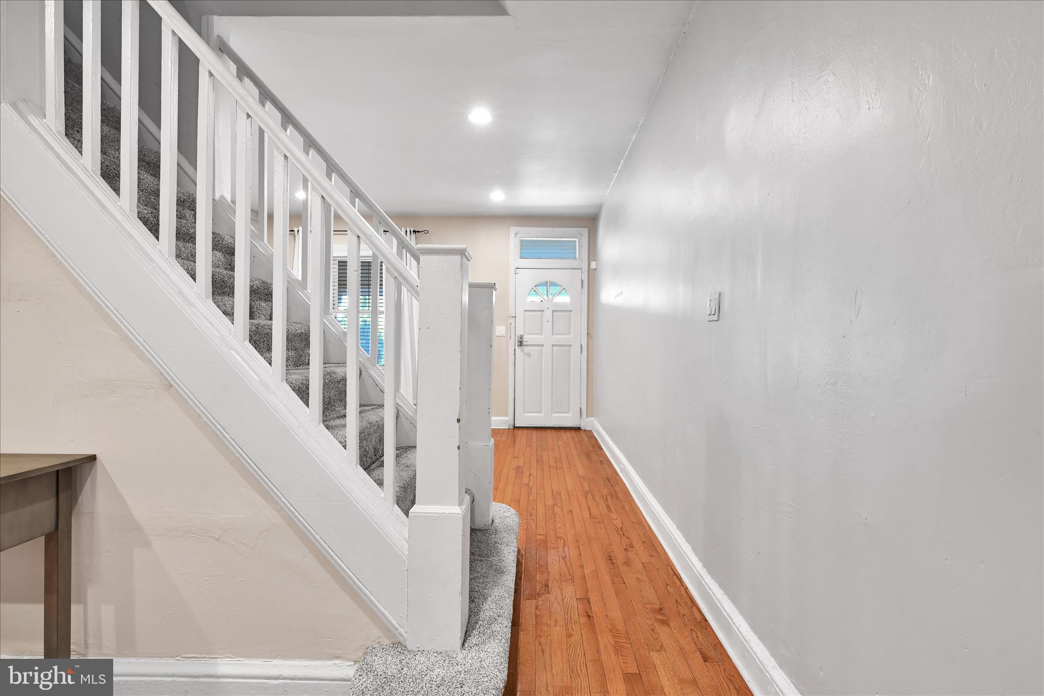 205 Front Street Conshohocken, PA 19428 - Photo 9 of 31 a view of staircase with lots of frames on wall and wooden floor