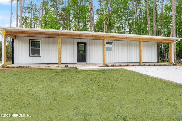 a front view of a house with yard