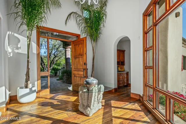 a kitchen with granite countertop wooden cabinets stainless steel appliances and a sink