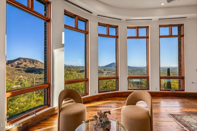 a view of a mountain in the distance in a field