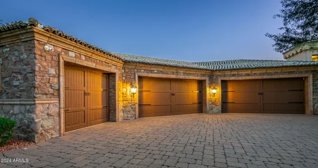 a view of a patio with furniture and a backyard