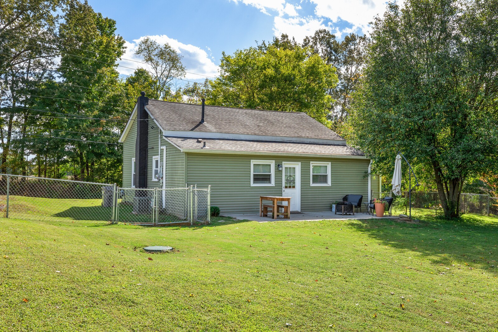 2531 Pleasant View Road Pleasant View, TN 37146 - Photo 32 of 35 a view of a house with a yard patio and a tree