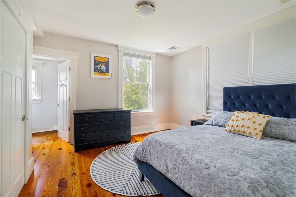70 Oxford Street Somerville, MA 02143 - Photo 24 of 38 a bedroom with a bed and window