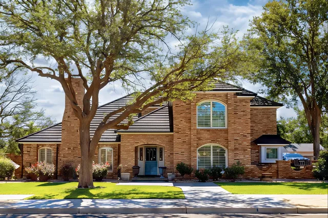 a kitchen with stainless steel appliances a refrigerator sink and cabinets