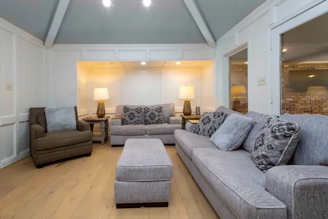 a kitchen with a refrigerator sink and cabinets