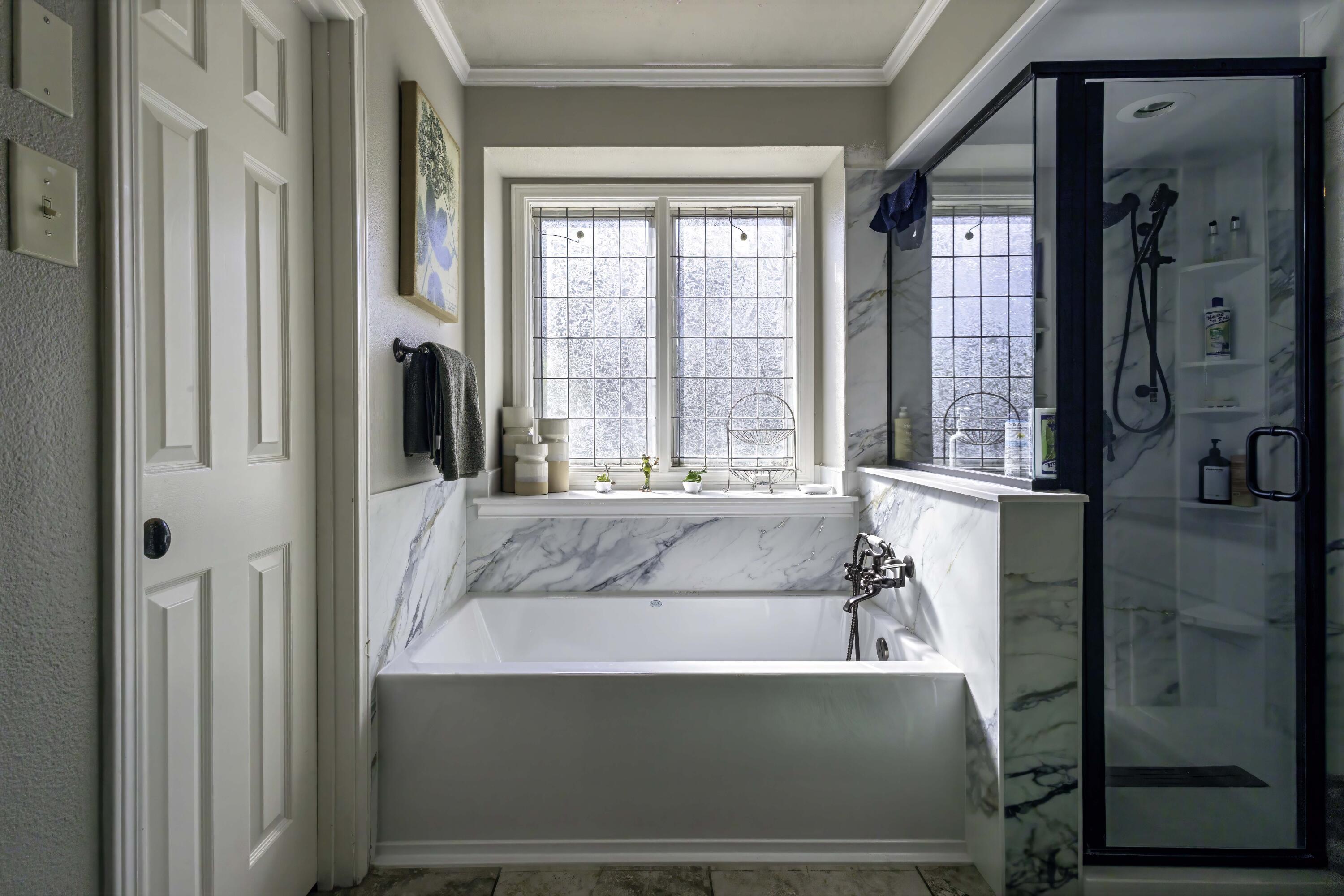 5101 2nd Street Lubbock, TX 79416 - Photo 23 of 41 a living room with a large window and a glass door
