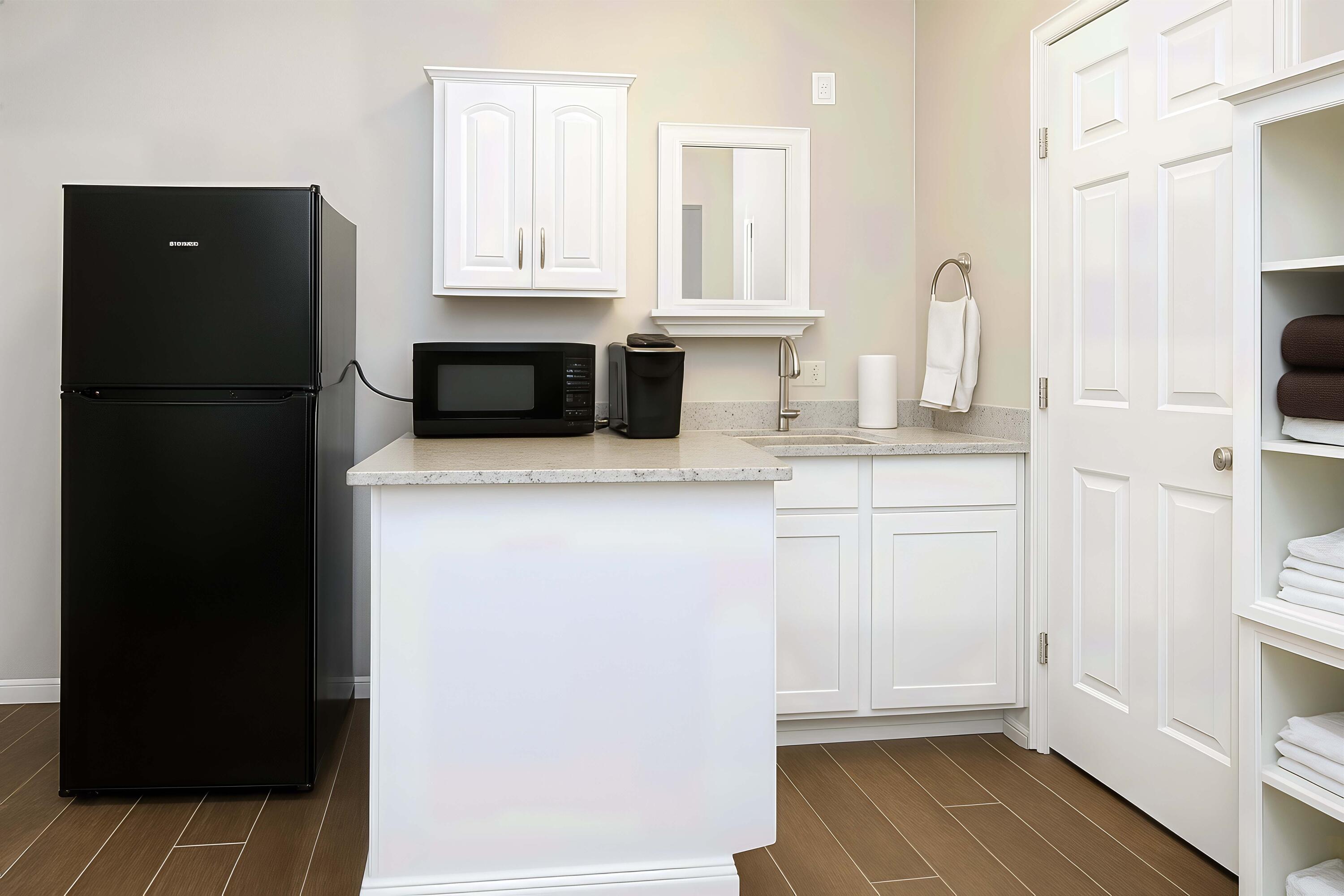5101 2nd Street Lubbock, TX 79416 - Photo 36 of 41 a kitchen with a refrigerator sink and cabinets