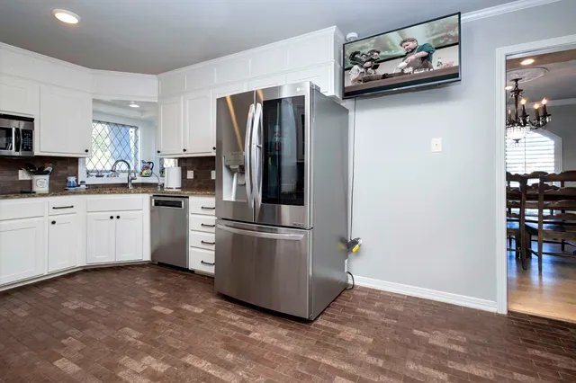 a bathroom with a sink vanity and a mirror