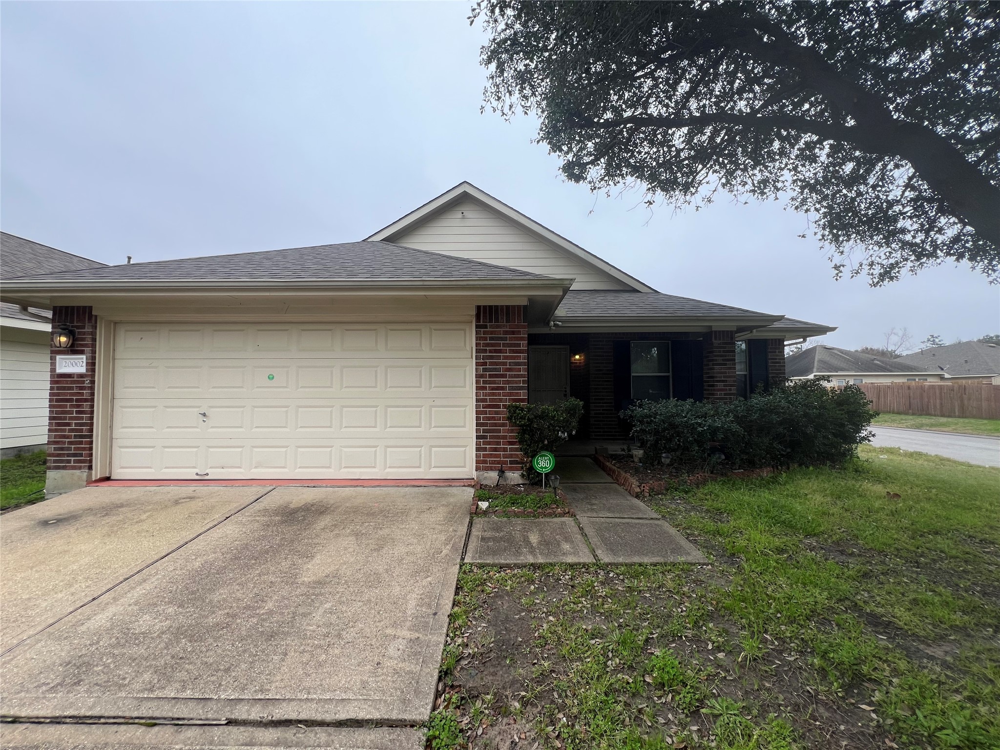 20002 Karlanda Lane Houston, TX 77073 - Photo 1 of 24 a front view of house with yard and trees around