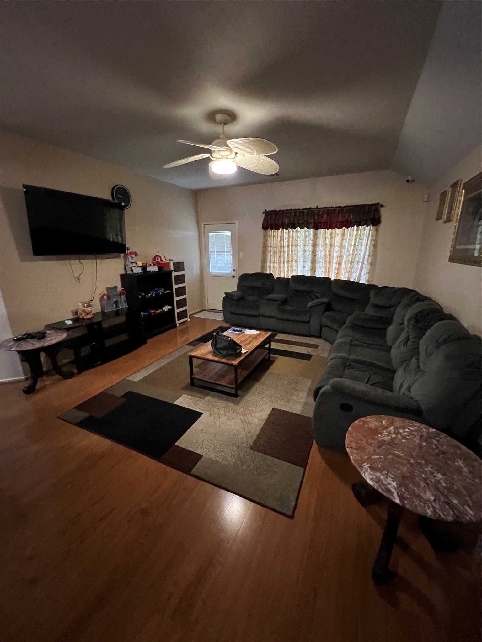 20002 Karlanda Lane Houston, TX 77073 - Photo 14 of 24 a living room with furniture a flat screen tv and kitchen view