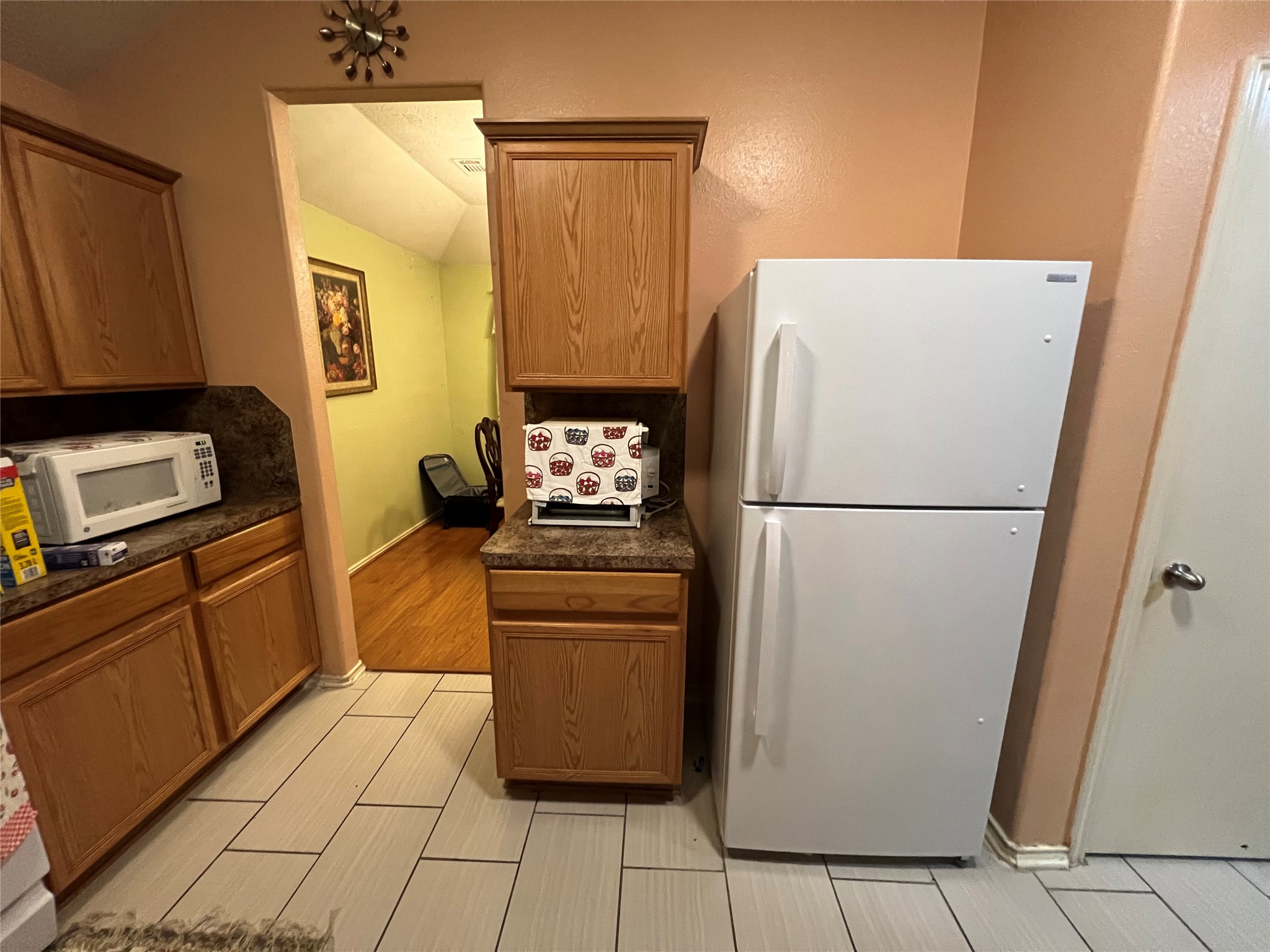 20002 Karlanda Lane Houston, TX 77073 - Photo 17 of 24 a kitchen with a refrigerator a stove top oven and cabinets