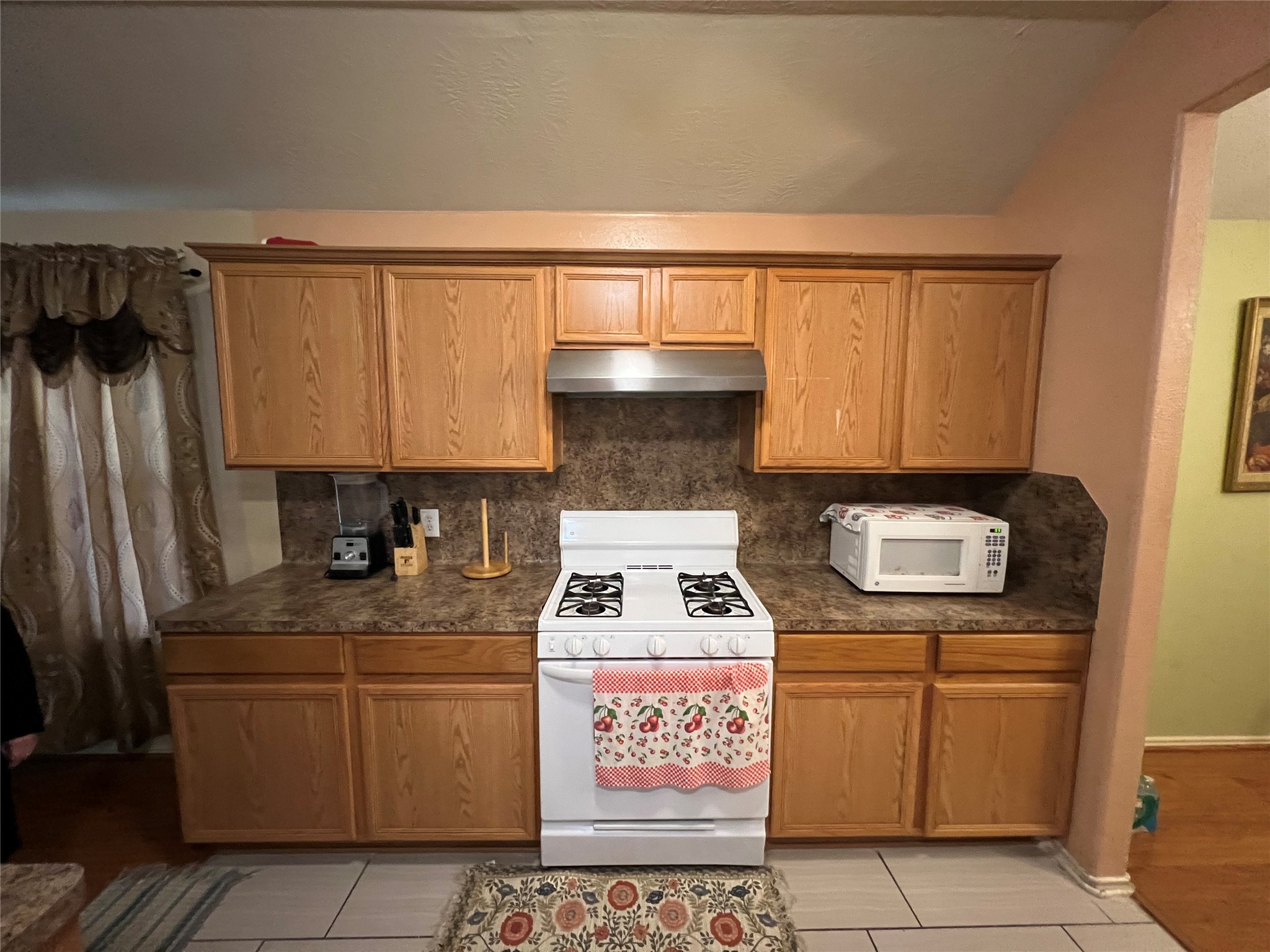 20002 Karlanda Lane Houston, TX 77073 - Photo 19 of 24 a kitchen with stainless steel appliances granite countertop a stove a sink and a microwave