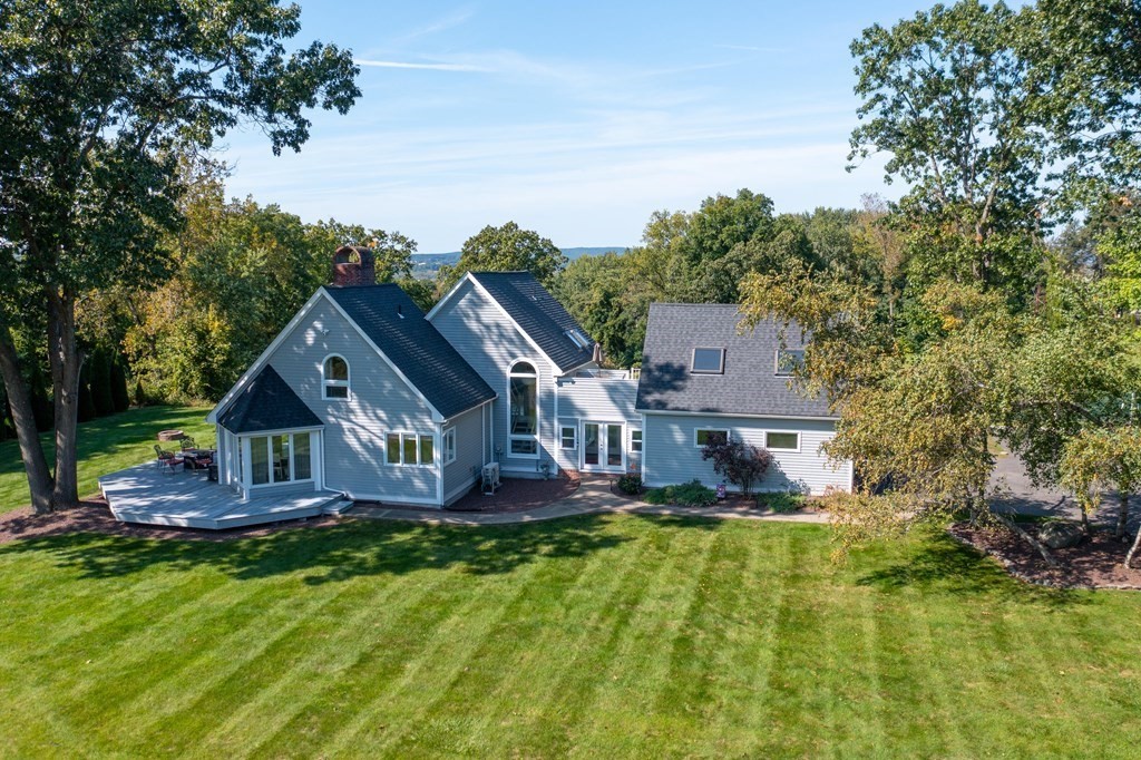 54 Kennedy Street Chicopee, MA 01013 - Photo 1 of 42 a aerial view of a house with swimming pool next to a yard