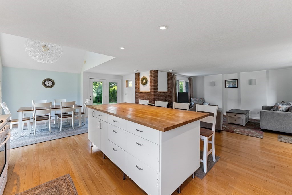 54 Kennedy Street Chicopee, MA 01013 - Photo 13 of 42 a hall with kitchen island stainless steel appliances wooden floor and living room view