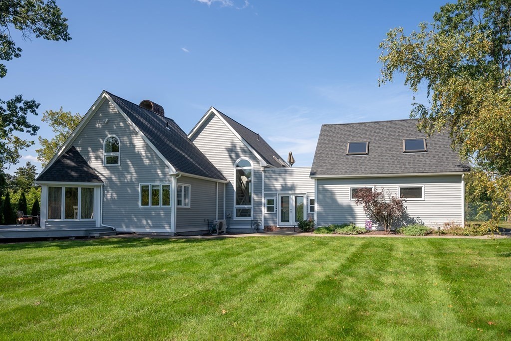 54 Kennedy Street Chicopee, MA 01013 - Photo 2 of 42 a front view of house with yard and green space