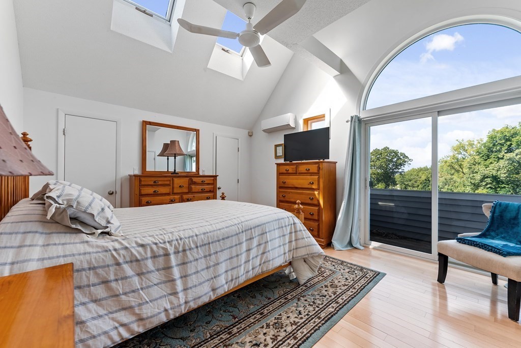 54 Kennedy Street Chicopee, MA 01013 - Photo 22 of 42 a bedroom with a bed and wooden floor