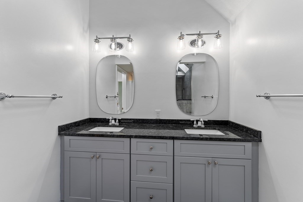54 Kennedy Street Chicopee, MA 01013 - Photo 23 of 42 a bathroom with a granite countertop sink and a mirror