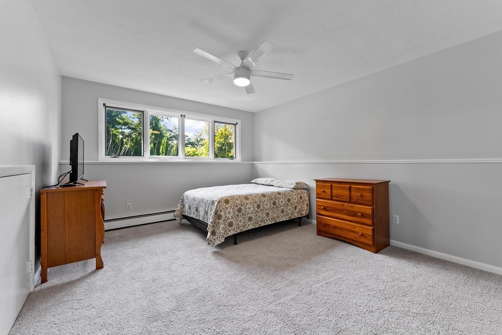 54 Kennedy Street Chicopee, MA 01013 - Photo 33 of 42 a bedroom with a bed and a chair