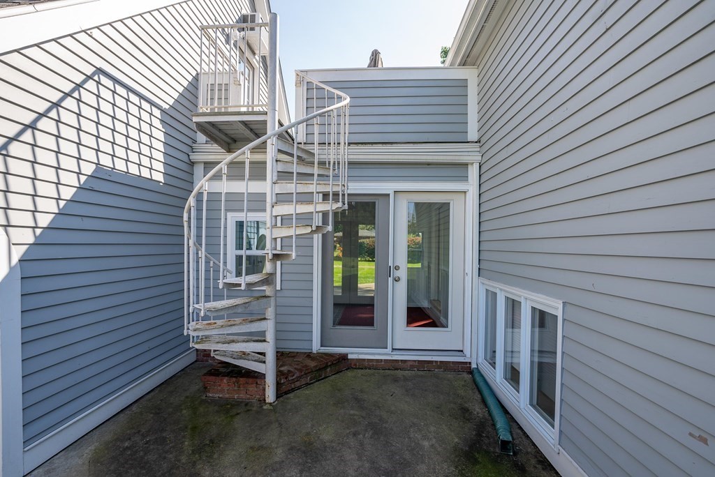 54 Kennedy Street Chicopee, MA 01013 - Photo 34 of 42 a view of a house with a door and wooden floor