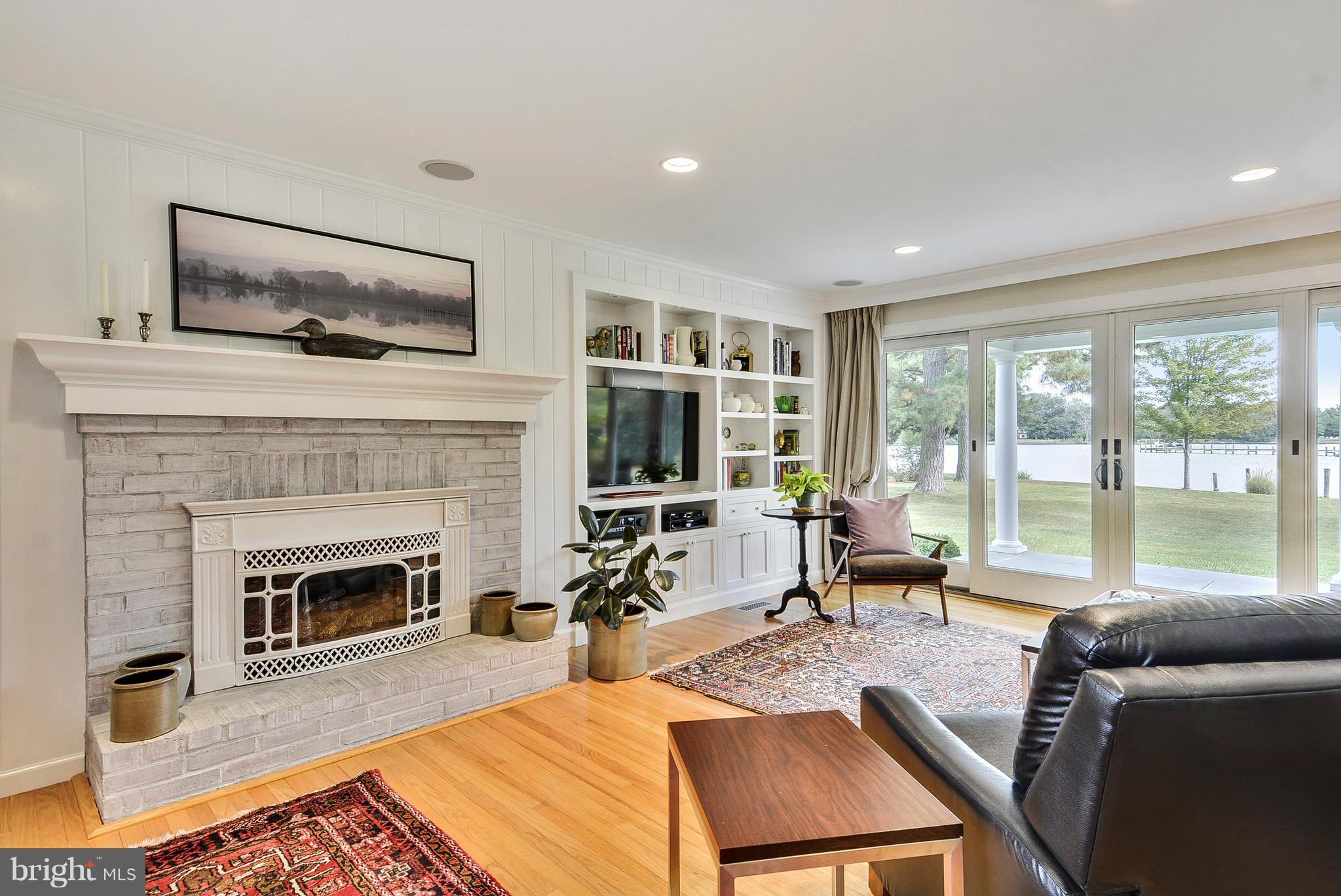25946 River Road Newcomb, MD 21653 - Photo 7 of 30 Living Room offers oak floors & gas fireplace