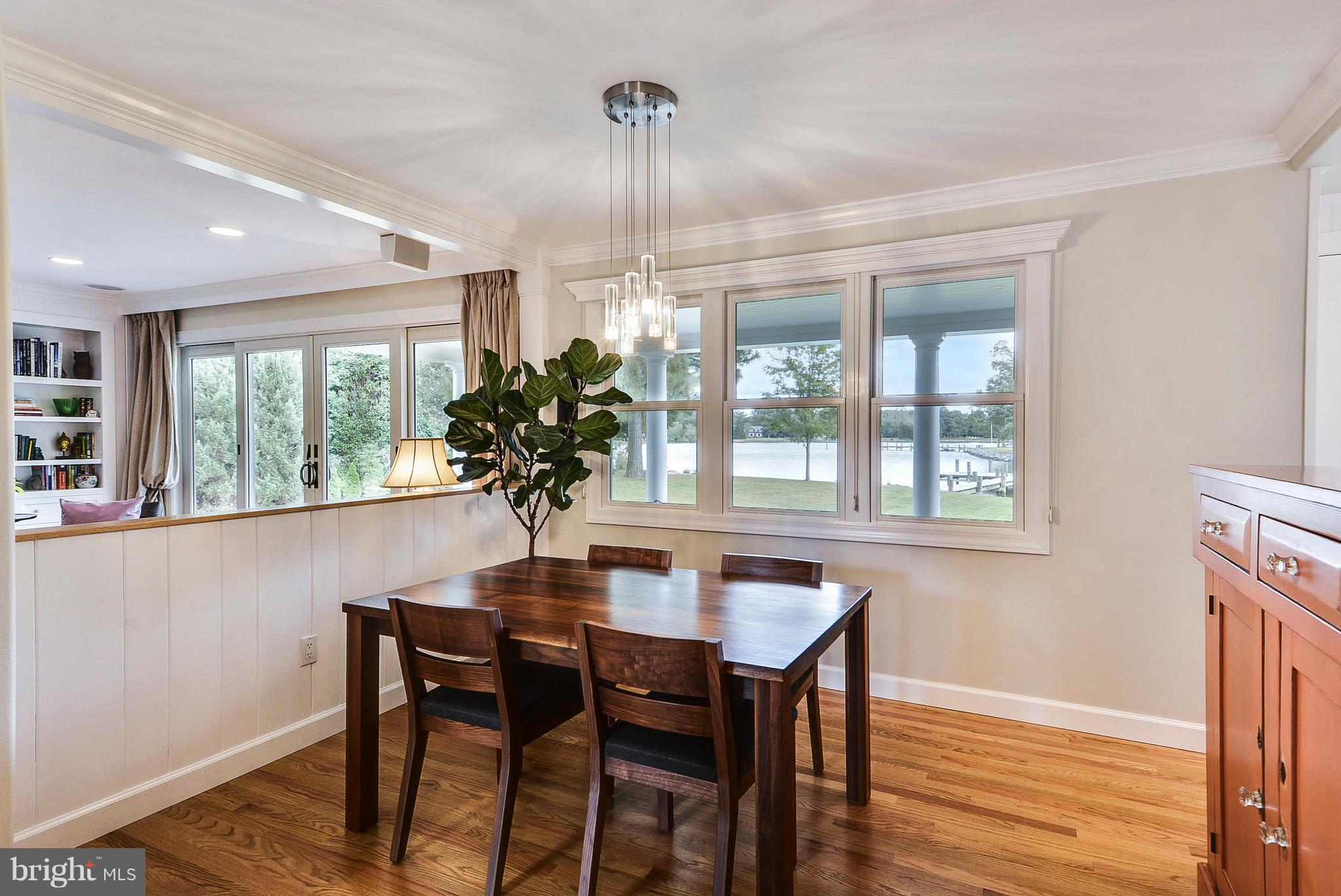 25946 River Road Newcomb, MD 21653 - Photo 10 of 30 Dining Room offers oak floors & entry to porch