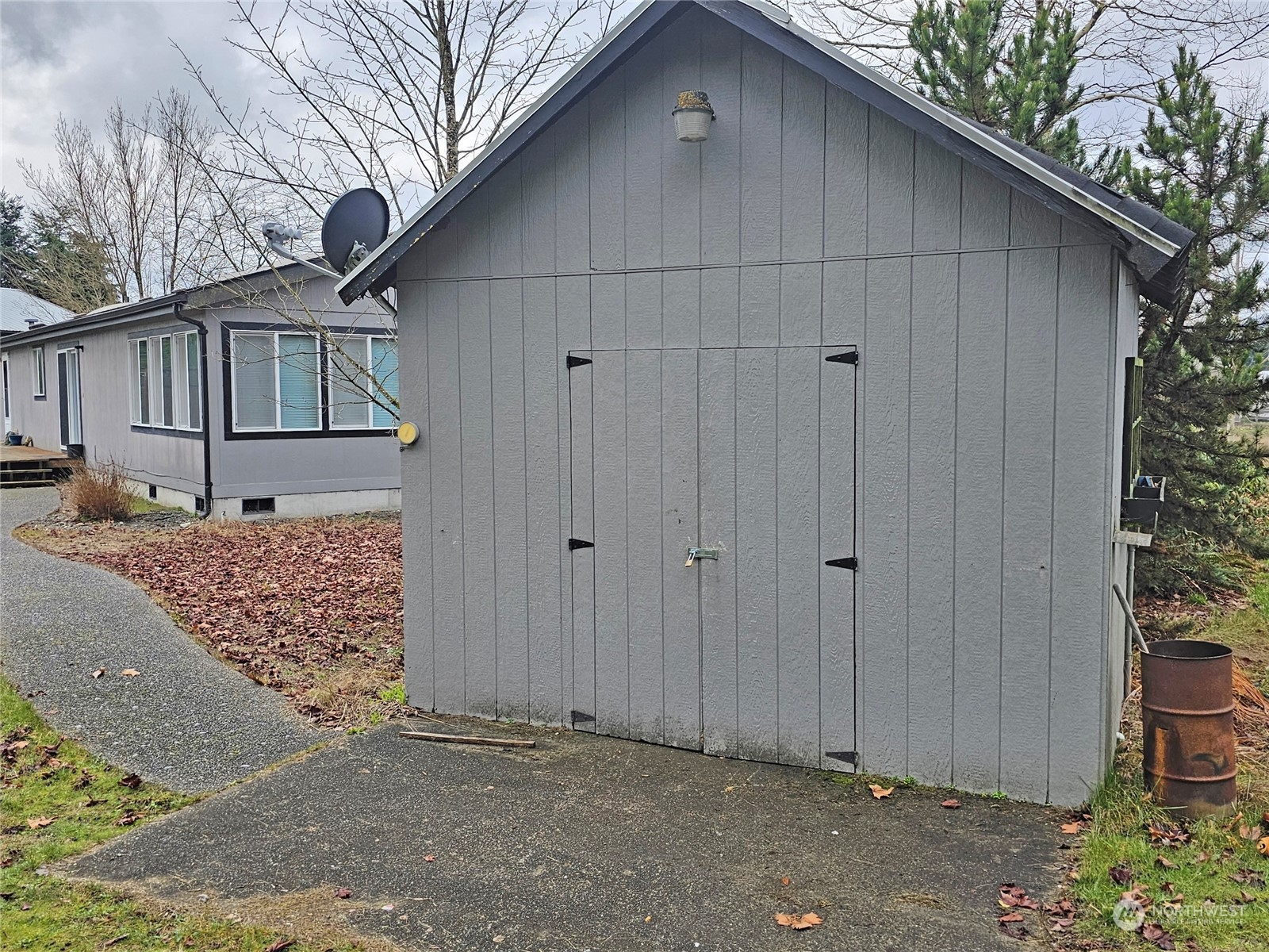9139 178th Avenue Southwest Rochester, WA 98579 - Photo 5 of 29 a view of a house with a wooden fence