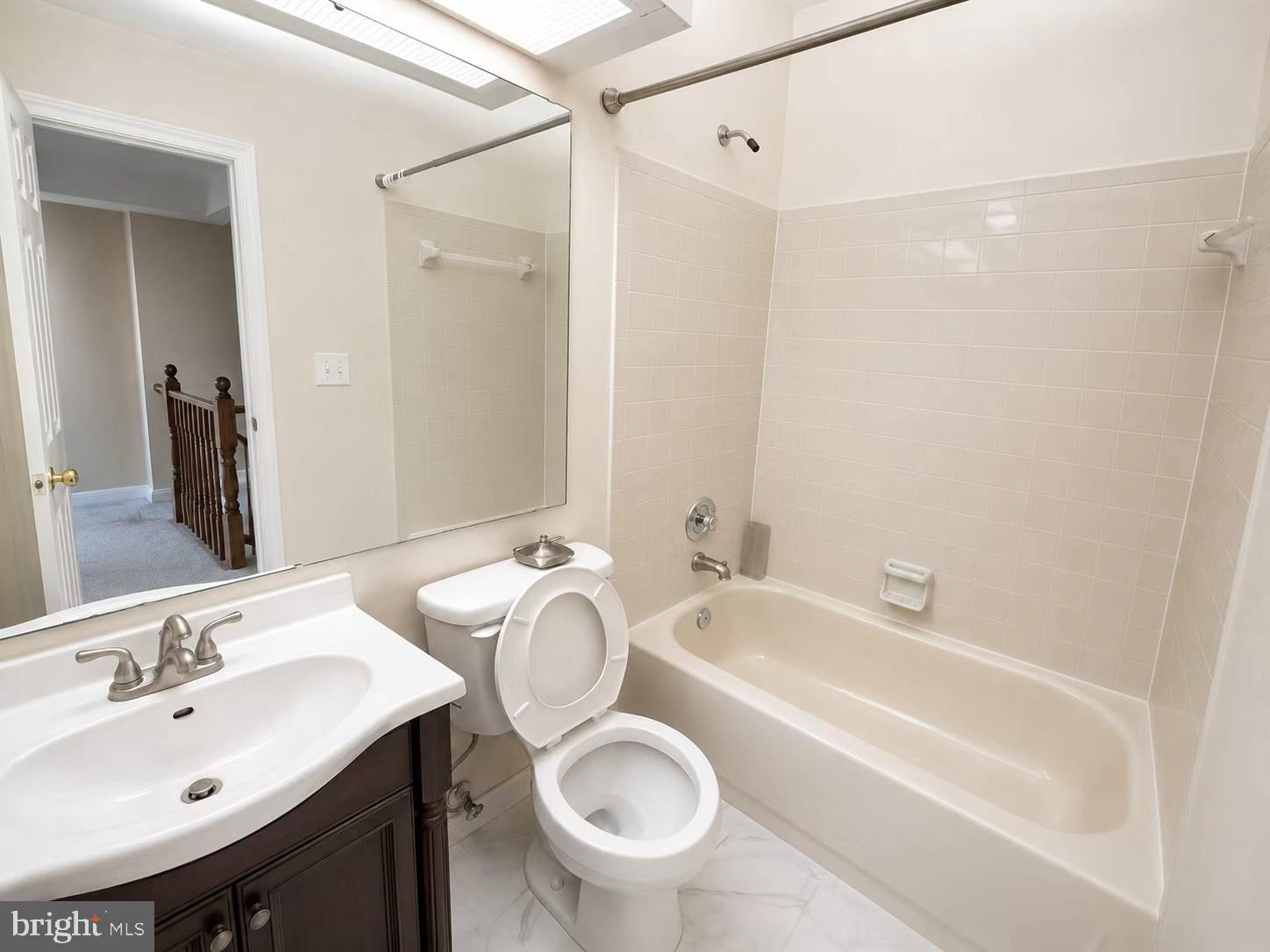 13336 Burkitts Road Fairfax, VA 22033 - Photo 9 of 14 a bathroom with a sink toilet and shower