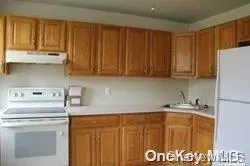 a bathroom with a sink a washer and dryer