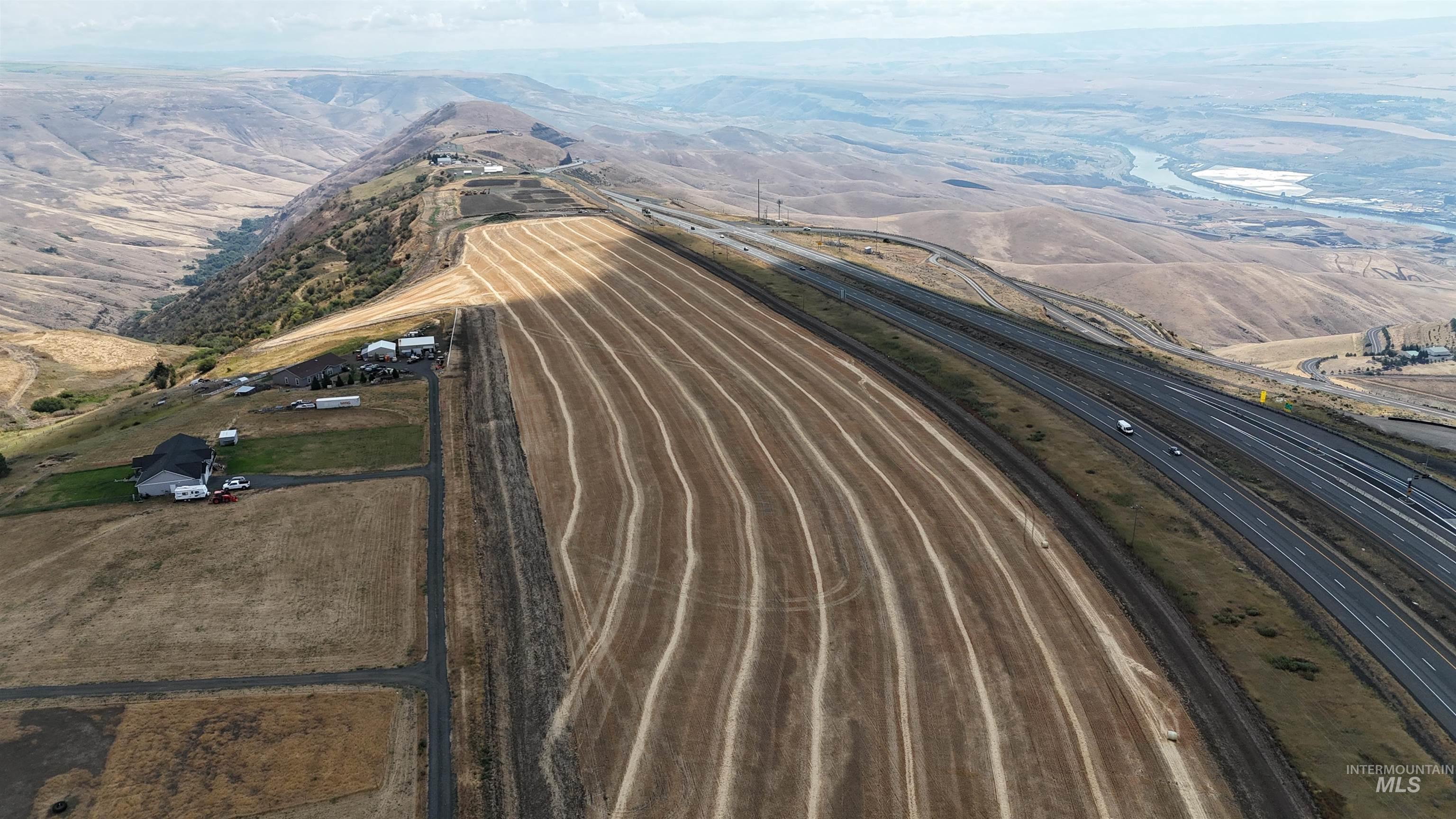 Tbd Spur Road Genesee, ID 83832 - Photo 12 of 12 Aerial view of property and surrounding area with a major roadway and mountains