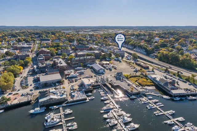 an aerial view of a city with parking