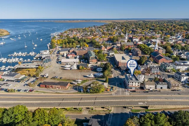 an aerial view of a building with parking space