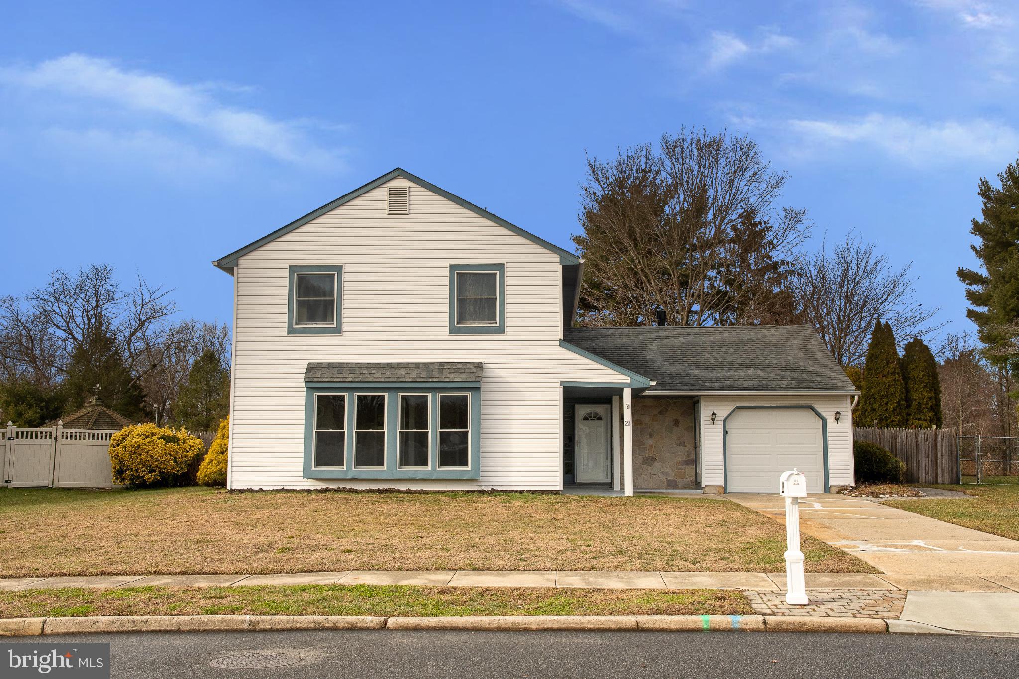 22 Duncan Road Sewell, NJ 08080 - Photo 1 of 46 a front view of a house with a yard and garage