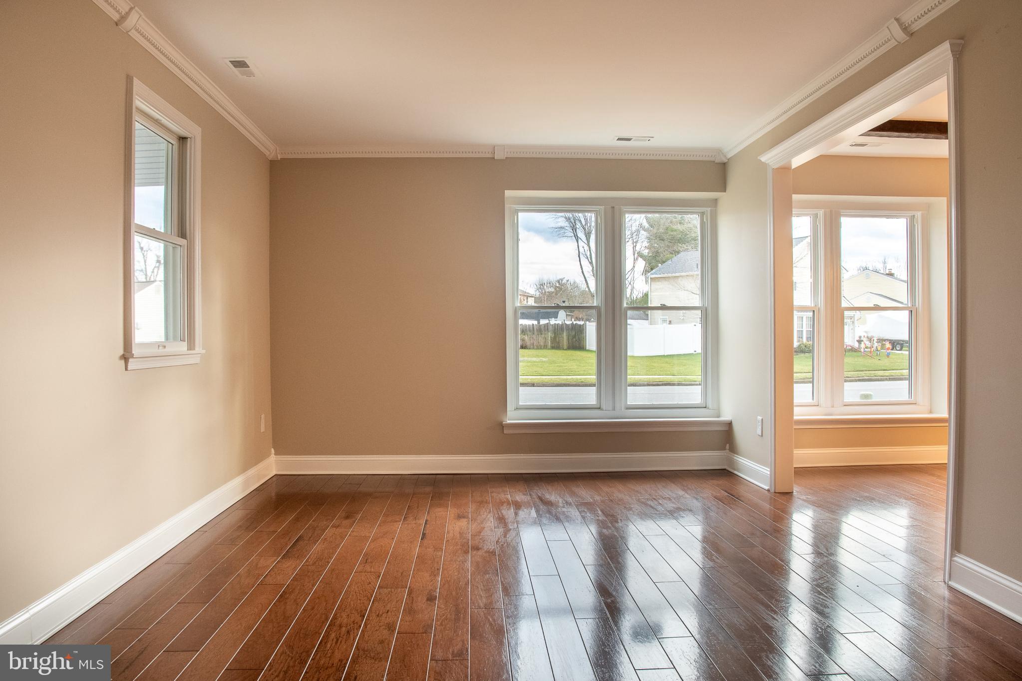 22 Duncan Road Sewell, NJ 08080 - Photo 14 of 46 a view of an empty room with wooden floor and a window