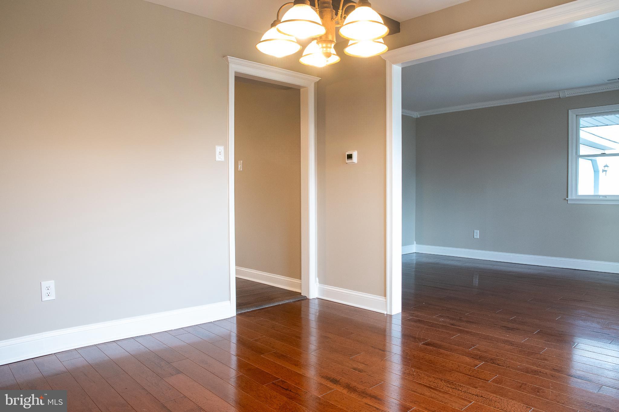 22 Duncan Road Sewell, NJ 08080 - Photo 17 of 46 wooden floor in an empty room with a mirror