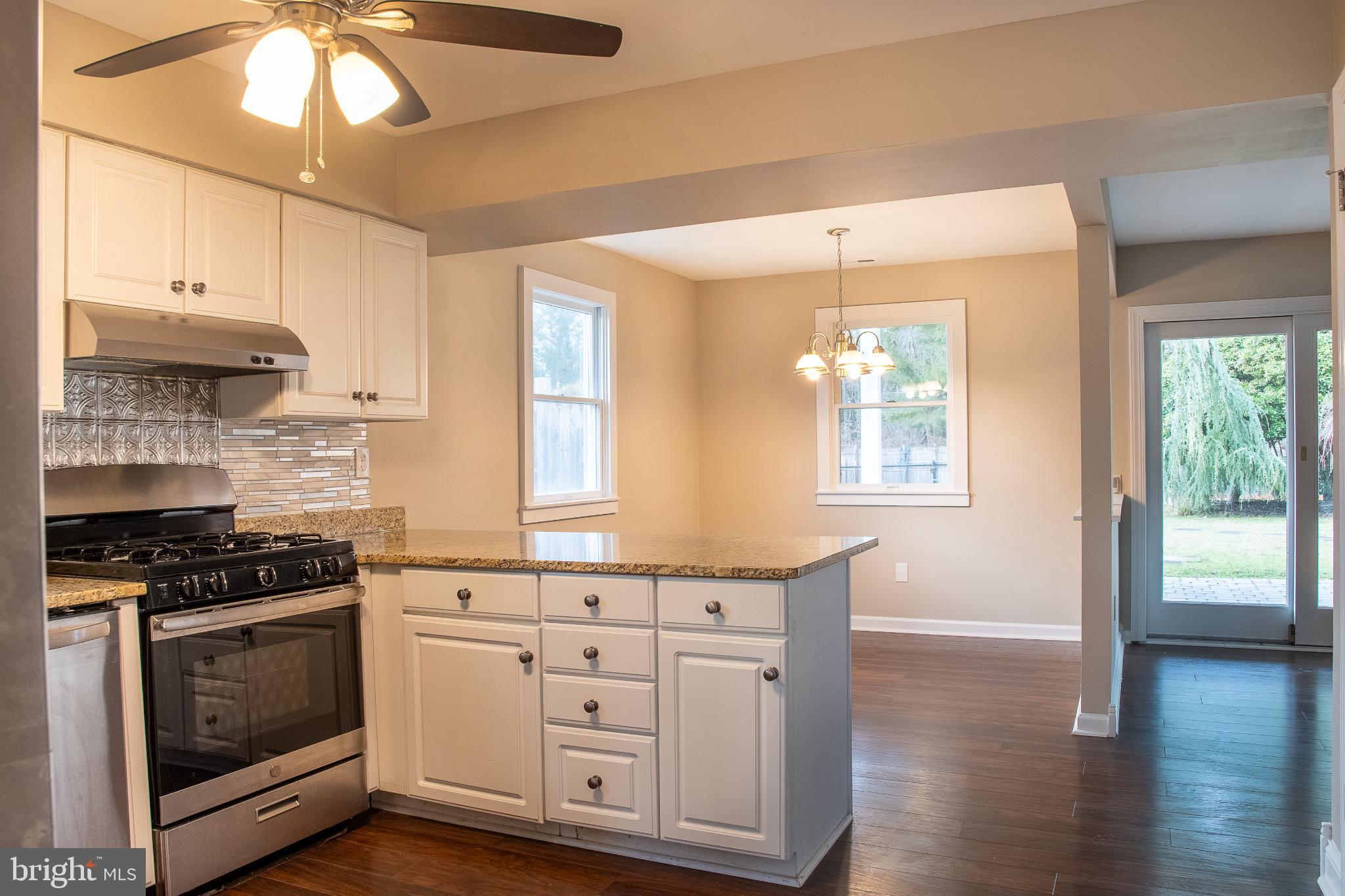 22 Duncan Road Sewell, NJ 08080 - Photo 21 of 46 a kitchen with stainless steel appliances a stove a sink and a refrigerator