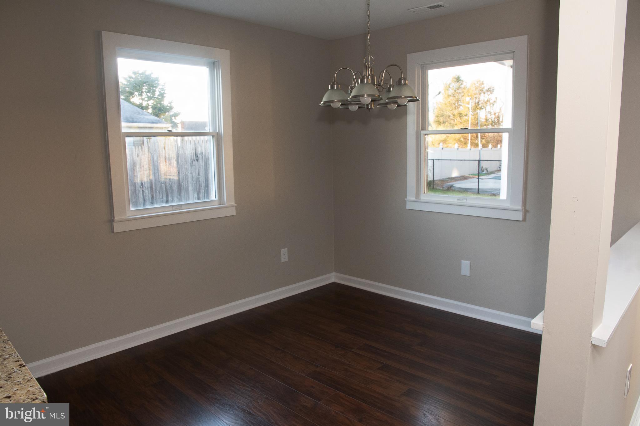22 Duncan Road Sewell, NJ 08080 - Photo 28 of 46 a view of an empty room with wooden floor and a window