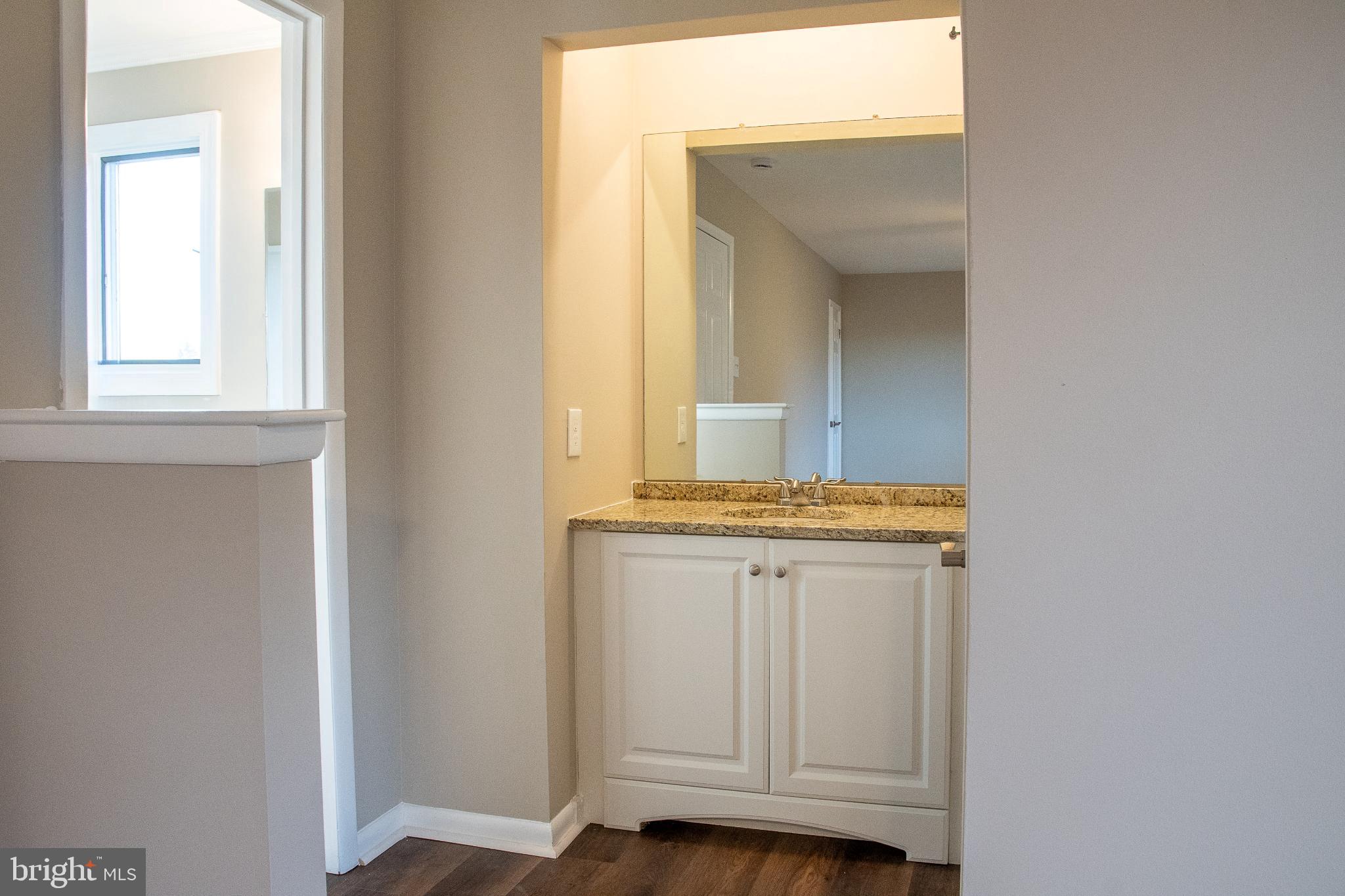 22 Duncan Road Sewell, NJ 08080 - Photo 36 of 46 a bathroom with a sink and a mirror