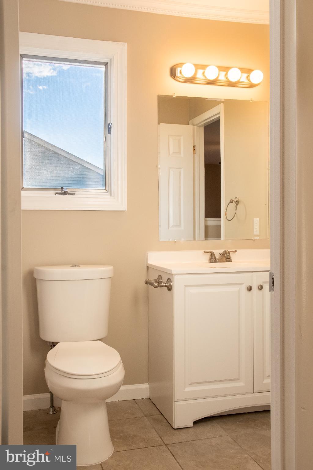 22 Duncan Road Sewell, NJ 08080 - Photo 37 of 46 a bathroom with a toilet sink and mirror