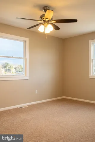 a view of a room that has a window in it