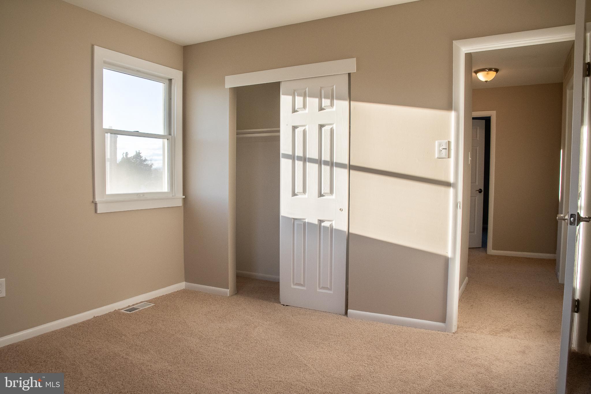 22 Duncan Road Sewell, NJ 08080 - Photo 41 of 46 an empty room with windows and refrigerator
