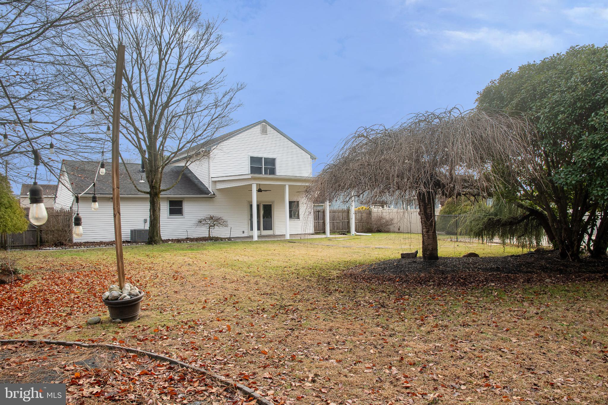 22 Duncan Road Sewell, NJ 08080 - Photo 5 of 46 a front view of a house with a yard covered with snow