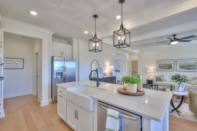 a kitchen with a dining table chairs and view kitchen