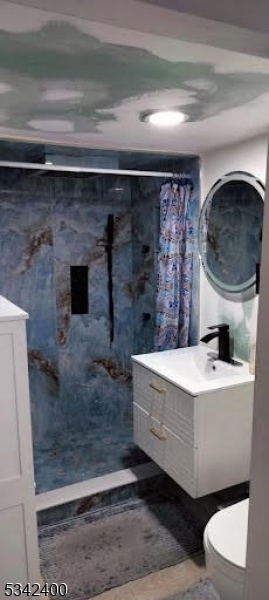 a bathroom with a sink a toilet and bathtub