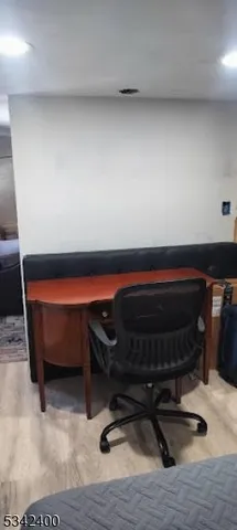 a room with furniture and wooden floor