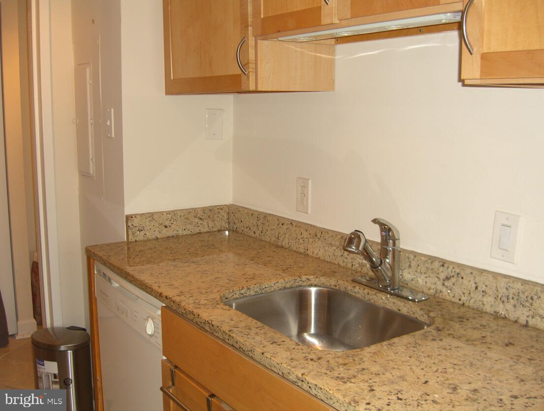 6800 Fleetwood Road, Unit 913 McLean, VA 22101 - Photo 9 of 13 Modern kitchen with sleek finishes.
